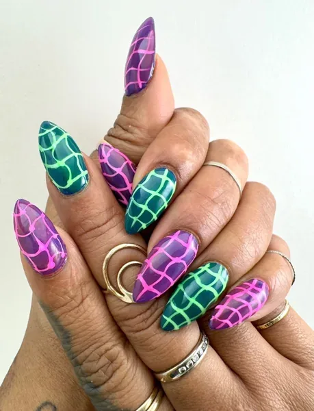 Jelly nails feature a glossy, translucent, glass-like finish that resembles fruit syrup or colorful hard candy while letting your natural nail line subtly peek 